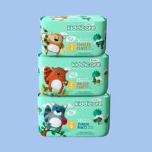 Load image into Gallery viewer, Stack of Kiddicare diaper packs on a teal background